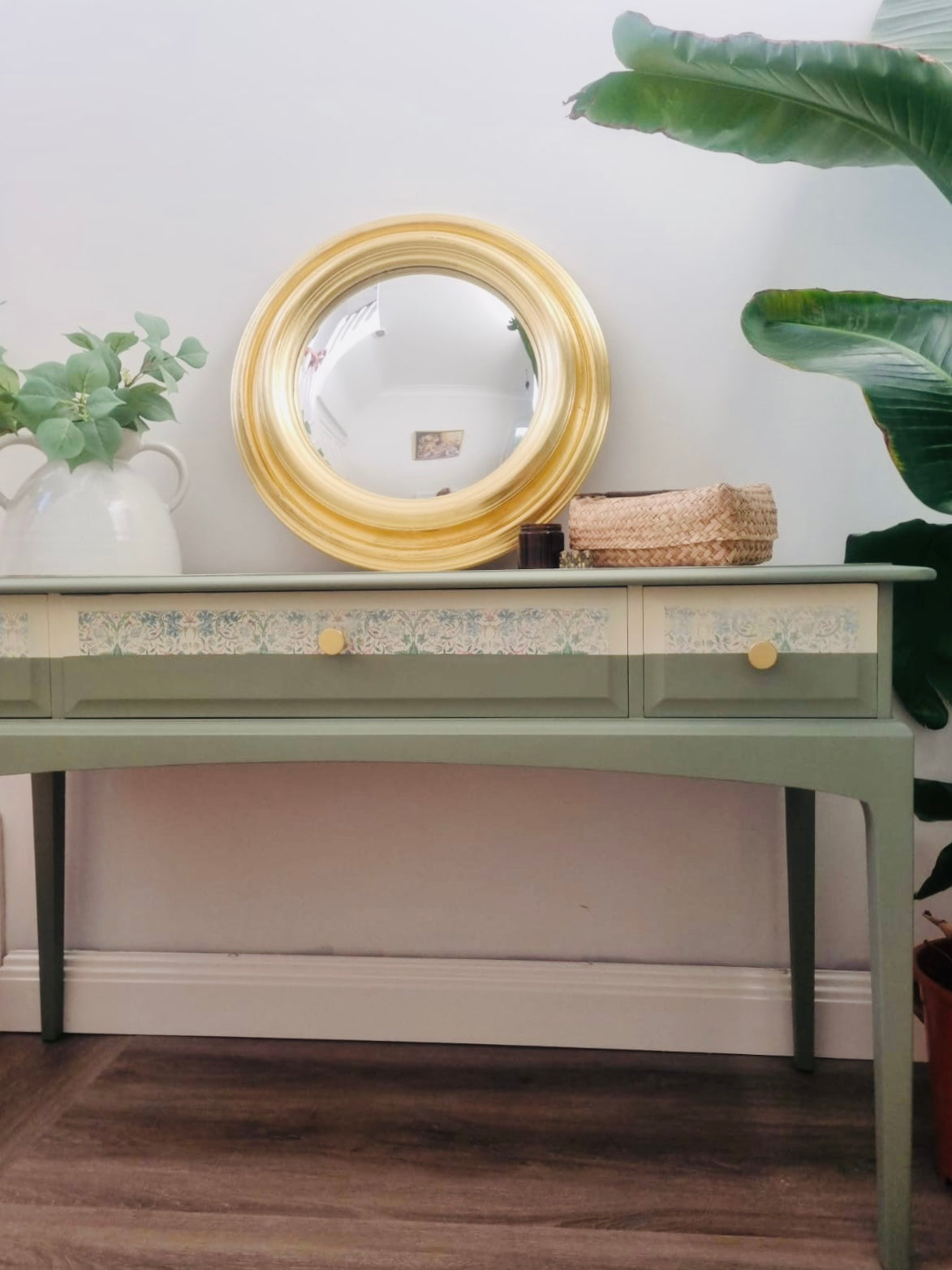 Stag Minstrel console table, painted in green with William Morris Strawberry theif paper detail and gold knobs