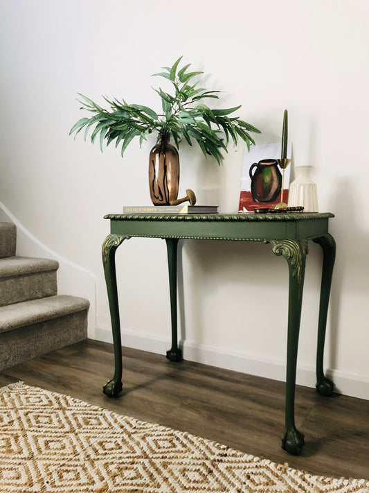 Green hand painted console table, with carved details and gold highlights